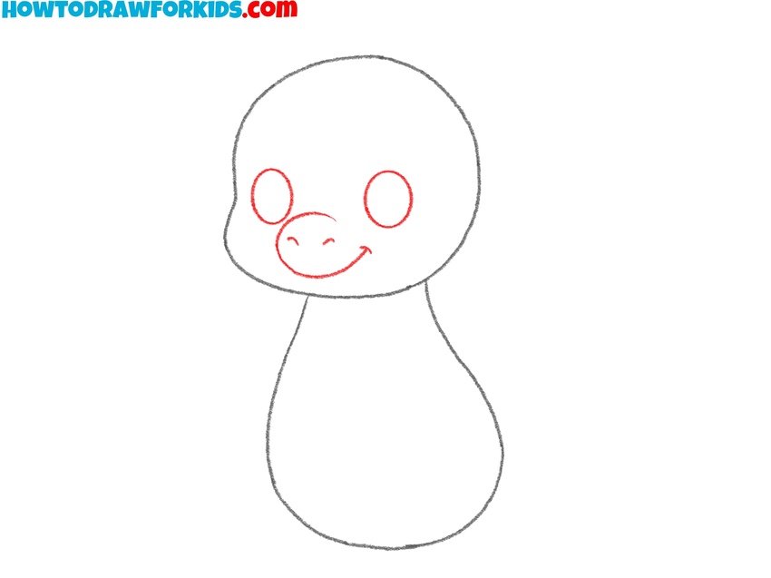 Draw the baby dragon eyes, nose, and mouth