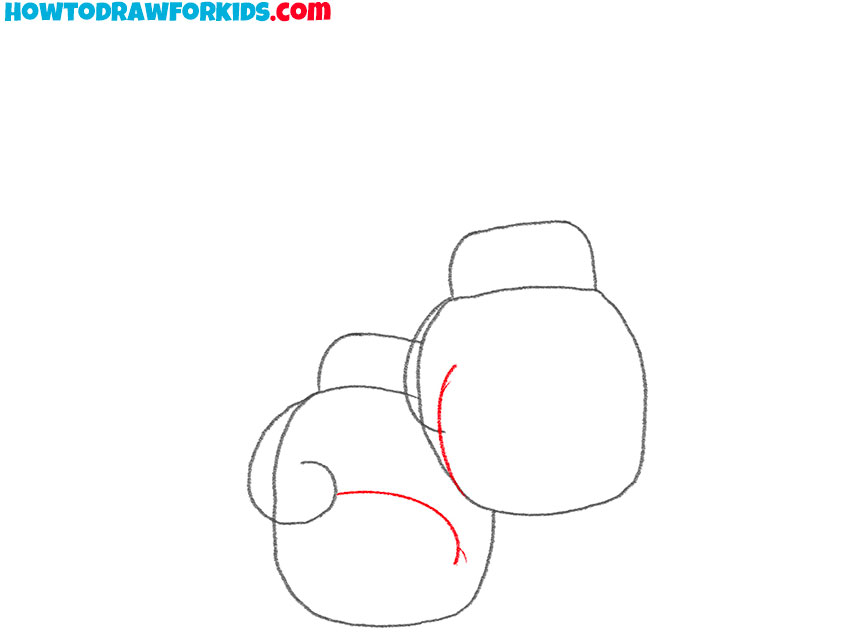 Draw the inner curves of the boxing gloves
