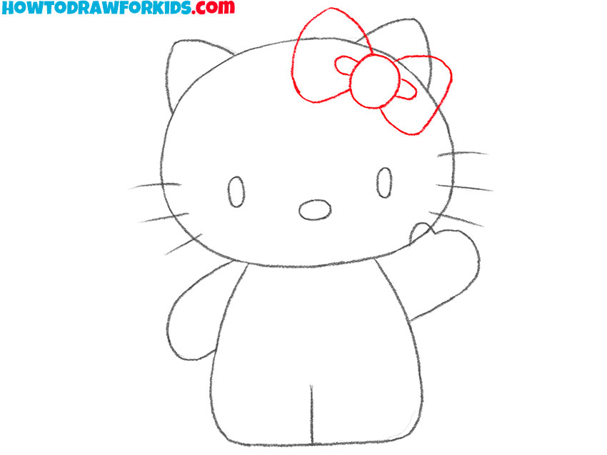 Sketch the bow at the top of the cat’s head