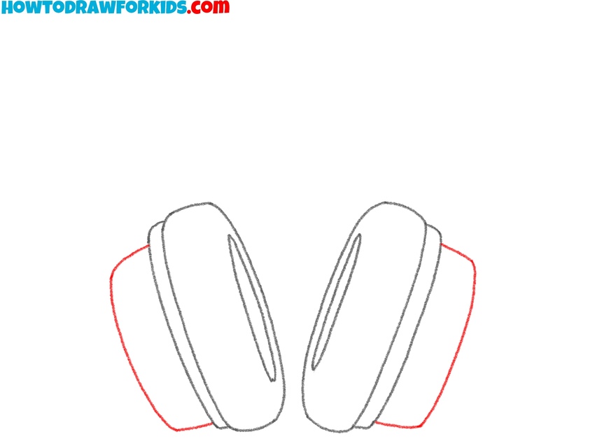 Outline the outer sides of the ear cups